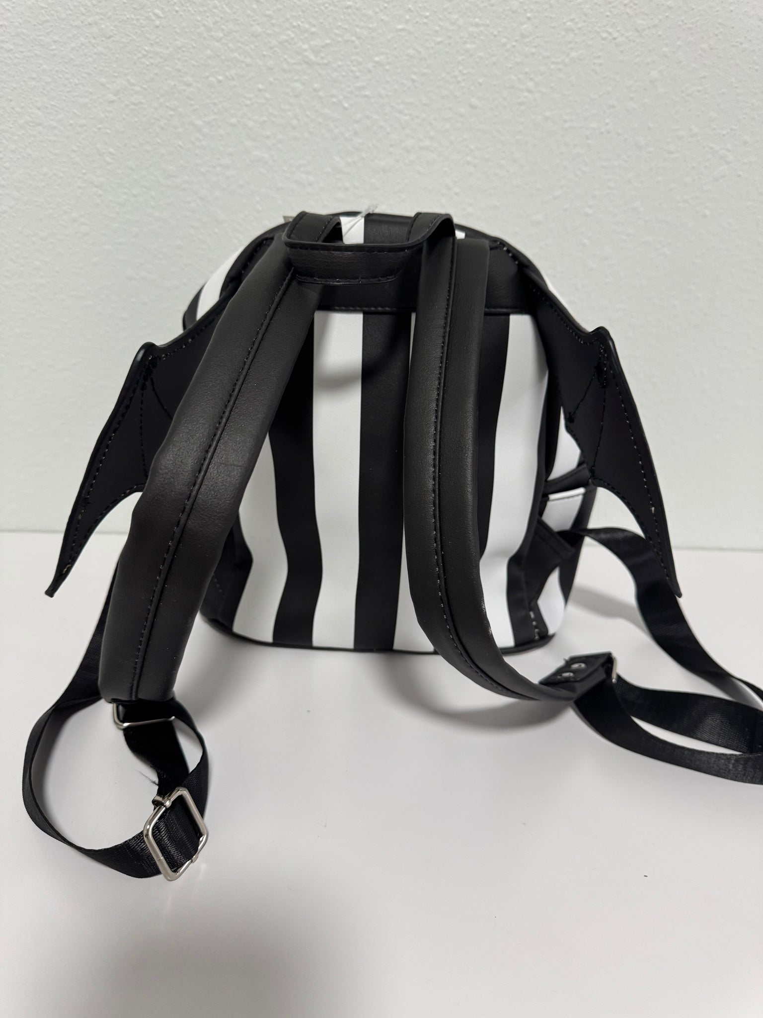 Bat wing striped backpack