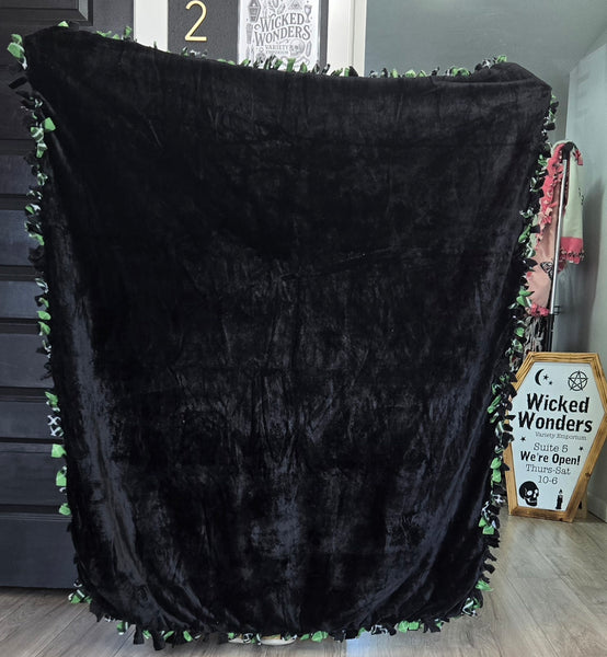 Green plaid tied blanket
