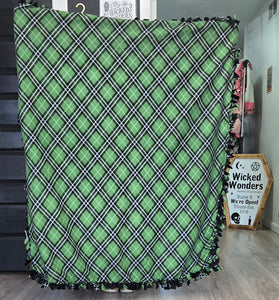 Green plaid tied blanket